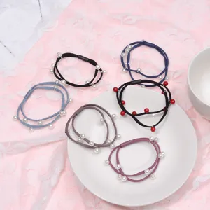 Sweet pearl hair ties detail shot, elastic rubber bands for women, elegant daily hair accessories.