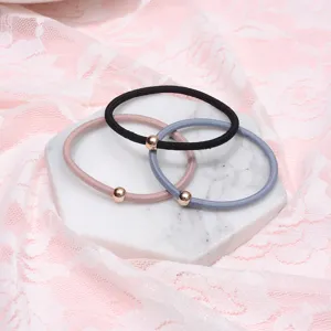 Detail shot of minimalist hair ties with metal beads, cute elastic hair bands set.