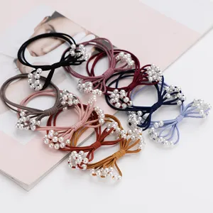 Detail shot of multi-layer pearl hair ties, elastic rubber bands with elegant pearl design.
