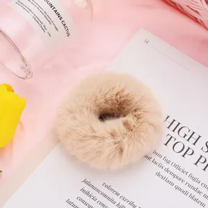 Fluffy plush hair scrunchie for women, soft winter furry hair tie, cute hair accessory.