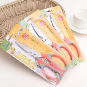 Multi-function kitchen scissors detail shot, special steel blades with ergonomic plastic handle.