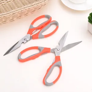 Stainless steel kitchen scissors detail view, multi-purpose bone cutter with ergonomic grip.