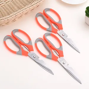 Multi-functional kitchen scissors with stainless steel blades and ergonomic plastic handles.