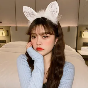 Detailed view of white lace feather cat ear headband, sweet style hair accessory for daily wear.