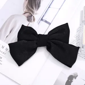 Pinza de pelo grande con lazo de tela negra, diseño elegante para peinado diario de mujeres.