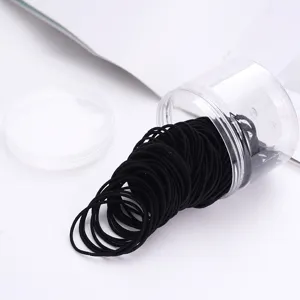 Black elastic hair ties set in a clear storage jar, high stretch hair bands for daily use.