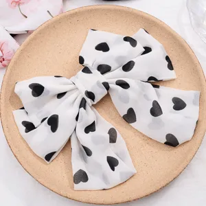 Chiffon large bow hair clip with black heart print, elegant sweet hair accessory for women.