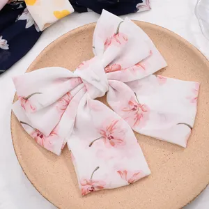Beautiful chiffon bow hair clip with sweet floral design for elegant daily styling.