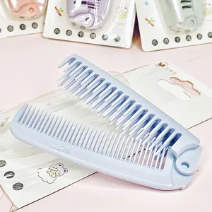 Portable foldable plastic hair comb for easy travel and daily styling use convenience.