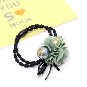 Elegant green floral hair tie with pearl rhinestone accents for daily charming hairstyles.