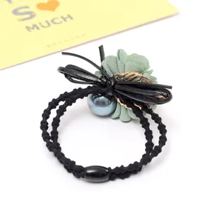 Elegant floral hair scrunchie with pearl and bow design for women fashion accessories daily wear