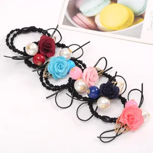 Vibrant floral hair ties set featuring fabric roses, pearls, and leaf charms for daily.