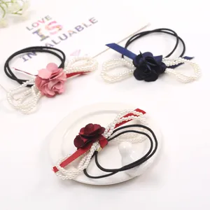 Elegant pearl flower hair tie with ribbon bows and elastic bands for women girls daily wear.