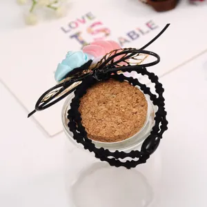Floral hair tie with fabric flowers and black elastic band, perfect for daily styling.
