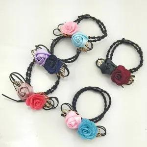 Set of black hair ties decorated with colorful fabric roses and golden leaves for women daily use.