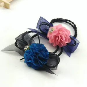 Exquisite fabric flower hair tie with mesh bow and dazzling crystal for women styling.