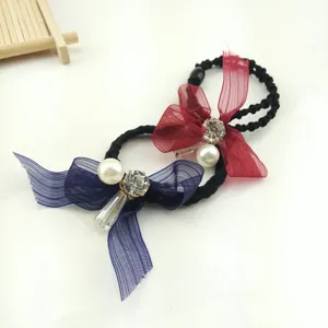 Fashion cute bow hair tie with pearl and rhinestone decoration, perfect for women daily styling.