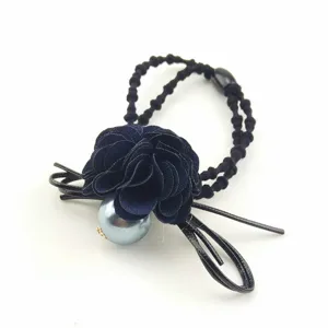 Elegant fabric flower hair tie with large pearl detail and bow accent, perfect for daily styling.