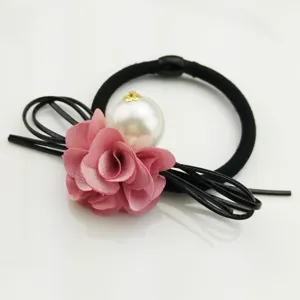 Exquisite camellia flower and pearl hair tie with black bow ribbons for women and girls.