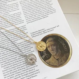 Retro coin pendant necklace detail showing exquisite metal texture and antique medallion design.