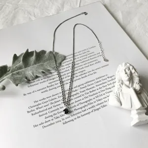 Elegant silver chain necklace with a sparkling black zircon pendant for daily chic wear.