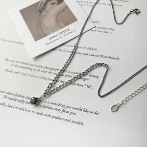 Exquisite silver chain necklace featuring a black zirconia pendant and adjustable tail.
