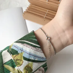 Minimalist silver chain bracelet for women, elegant wrist jewelry with extension chain style.