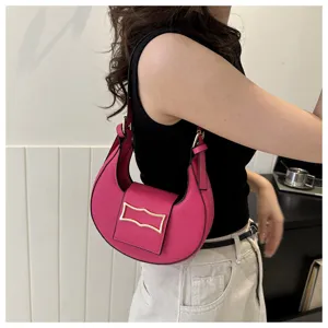Pink crescent underarm shoulder bag for women, stylish niche luxury crossbody handbag detail.