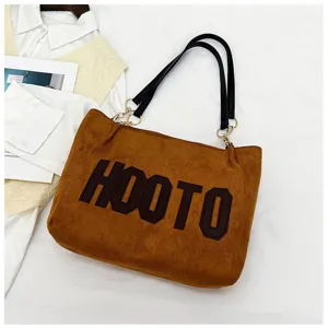 Stylish brown suede shoulder tote bag, large capacity commuting handbag for women.