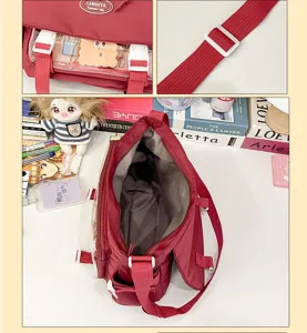 Cute college style messenger bag detail view, large capacity canvas shoulder bag for student daily.
