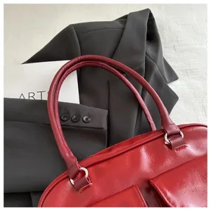 Red vintage PU leather bowling handbag close-up detail showcasing retro style and chic design.