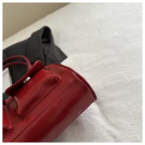 Red retro patent leather Boston handbag for women, vintage style tote bag with front pocket.