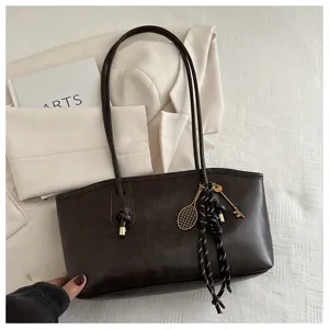 Vintage dark brown tote bag with metal charms, large capacity stylish shoulder bag for women.
