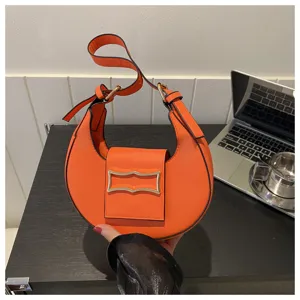 Chic orange crescent shoulder bag for women, stylish hobo PU leather handbag for daily wear.