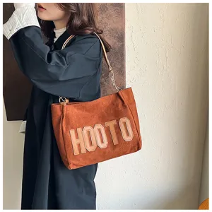Stylish brown suede shoulder tote bag for women, large capacity commuting handbag for daily use.