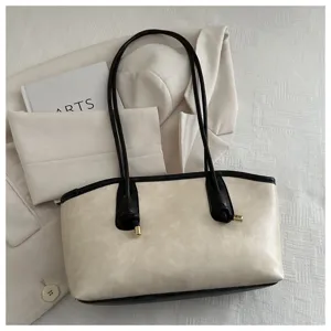 Detail view of the elegant vintage beige and black tote shoulder bag, premium minimalist aesthetic.