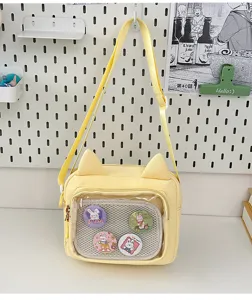 Cute yellow cat ear canvas ita bag with transparent pocket and sweet bunny badges for daily wear.