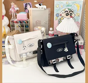 Detailed view of the cute college style messenger bag with transparent front pocket and canvas material.