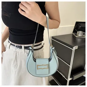 Light blue crescent shoulder bag, stylish underarm bag for women, trendy daily accessory.