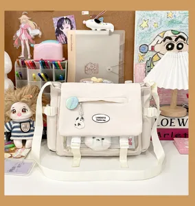 Canvas messenger bag for women, cute JK style shoulder bag with clear window and plush pendant.