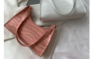 Women chic crocodile pattern shoulder underarm bag minimalist trendy baguette handbag detail.