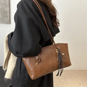 Vintage large capacity brown tote bag for women, stylish commuter shoulder bag with keychain.