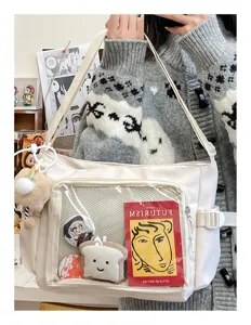 Canvas crossbody bag for women, large capacity messenger bag with clear front pocket.