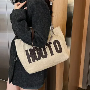 Casual canvas tote bag for women, large capacity shoulder bag, stylish commuter handbag.