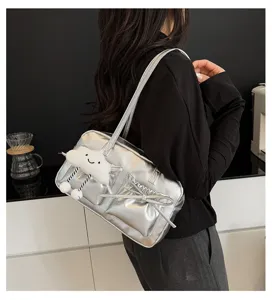 Stylish silver metallic bowling shoulder bag with bow and cute cloud charm for women.