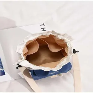 Cute Japanese canvas bucket bag for women, casual student messenger bag with inner pockets.