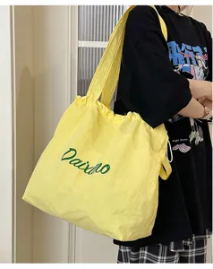 Detail view of the new 2025 drawstring casual tote bag, large capacity, perfect for daily commute.