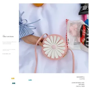 Cute pink round kids crossbody bag with white daisy flower design, perfect for little girls.