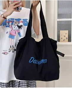 Casual large capacity black tote bag with drawstring, perfect for daily commuting and school use.