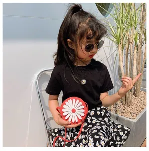 Kids round cross-body bag with cute daisy design, fashion PU leather purse for children.